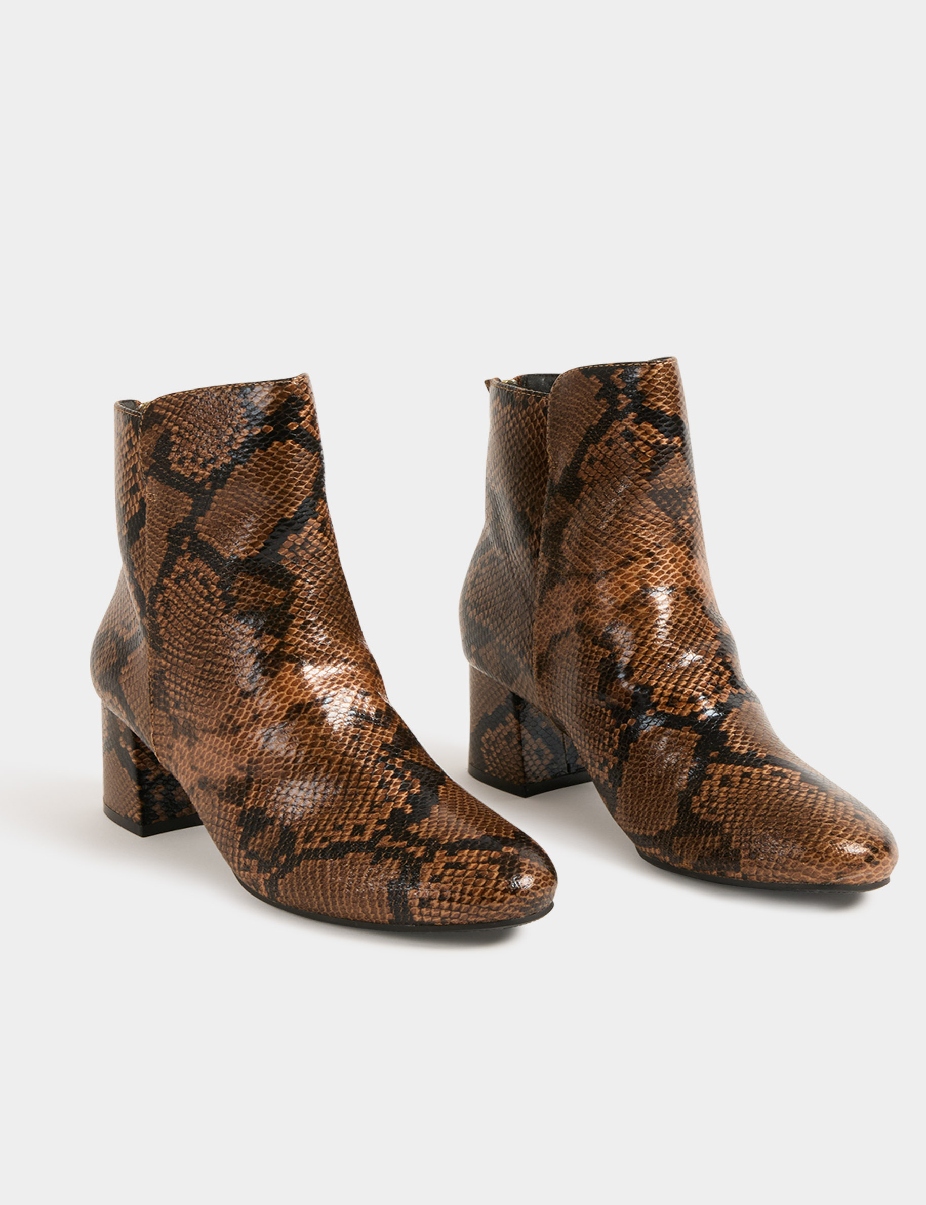 Snake print heeled boots beige women